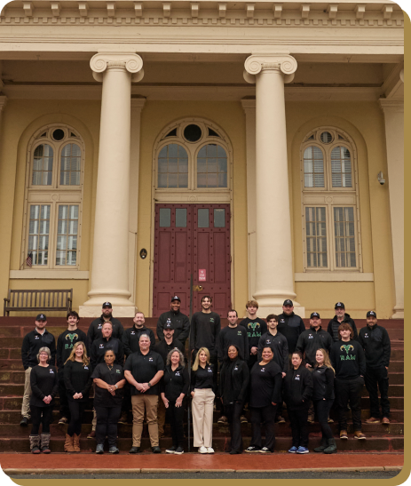 team photo in front of building